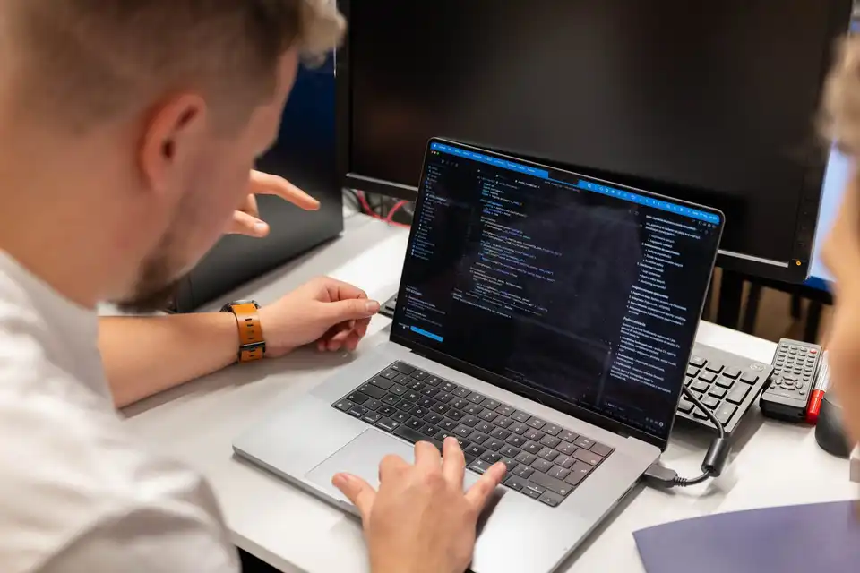 A laptop with code on the screen during a work session
